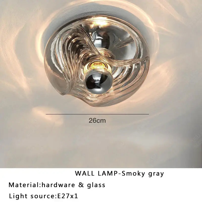 Modern circular swirling smoky gray decorbites designer glass wall lamp with translucent design and metallic hardware for bedroom