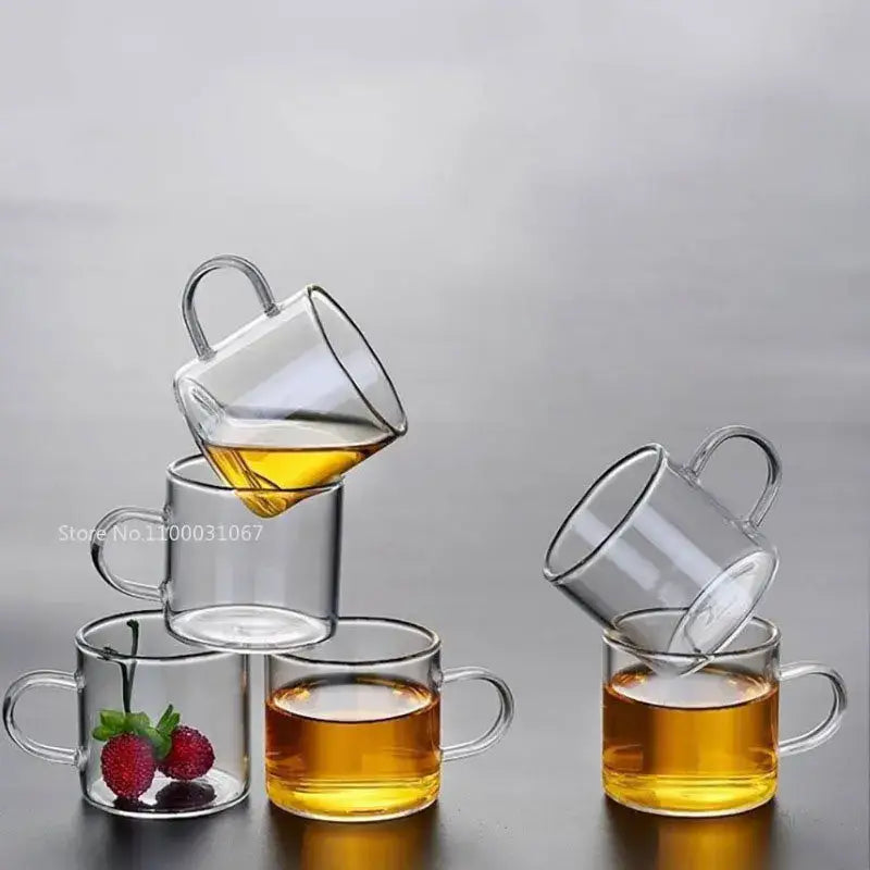 Modern clear 2pc 120ml glass handle coffee cup set with double-walled glass and curved handles, one cup with strawberries