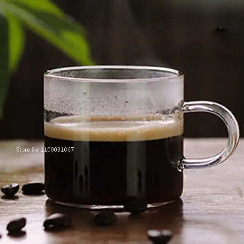 Modern clear 2pc 120ml glass handle coffee cup set with dark espresso and crema in a clear glass mug with handle