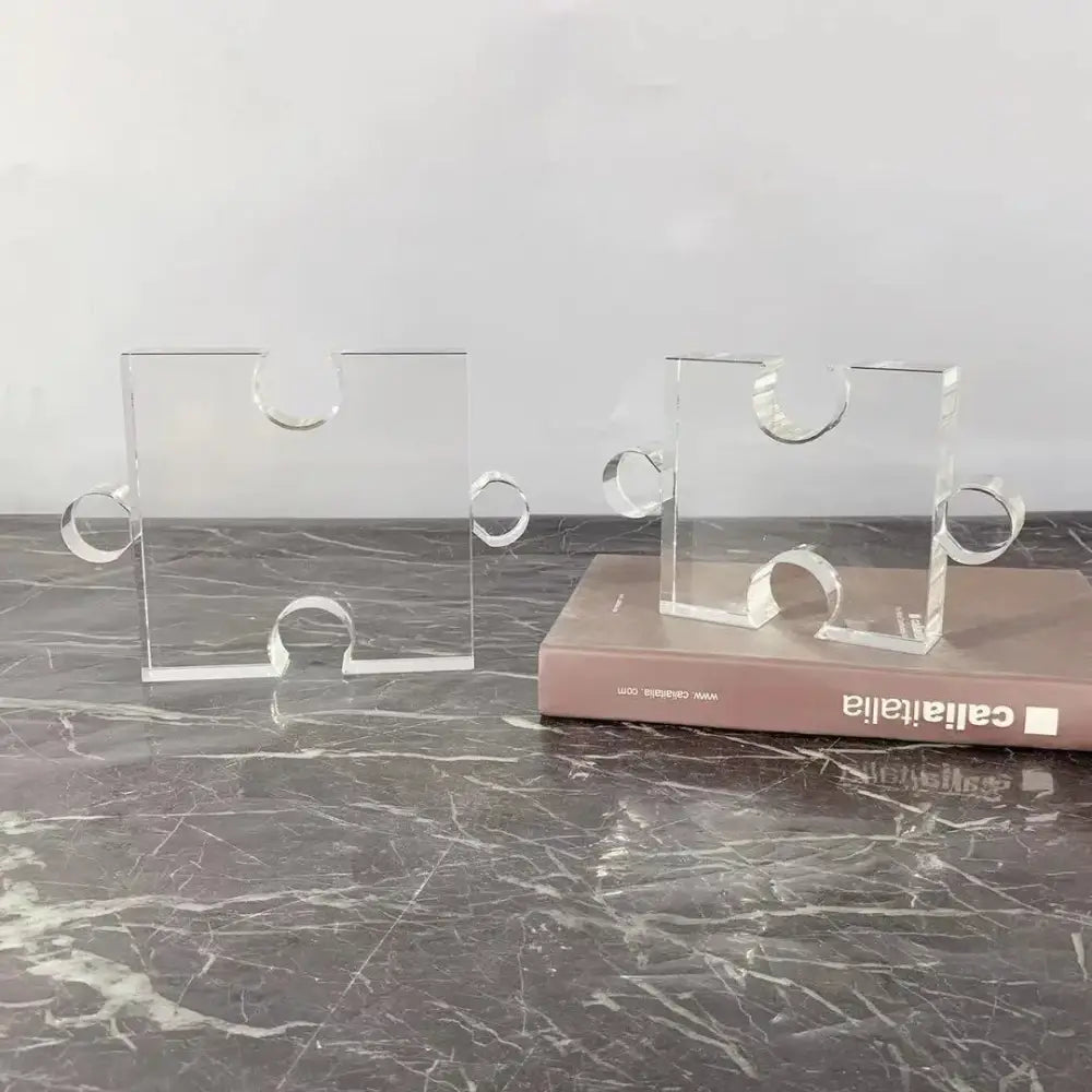Modern clear acrylic puzzle piece bookends in crystal geometric decorbites style for minimalist living room decor