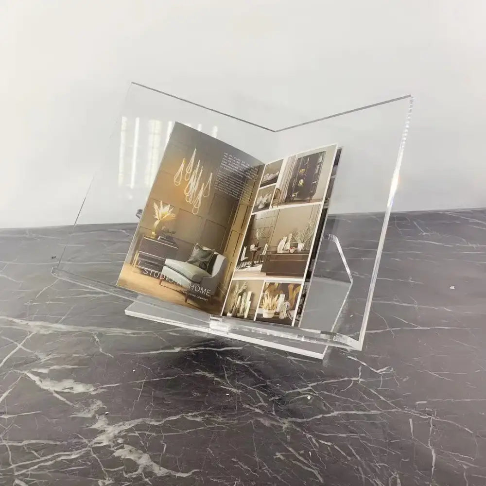 Modern clear acrylic geometric magazine rack holding an open magazine for office desktop storage by decorbites acrylic geometric bookshelf