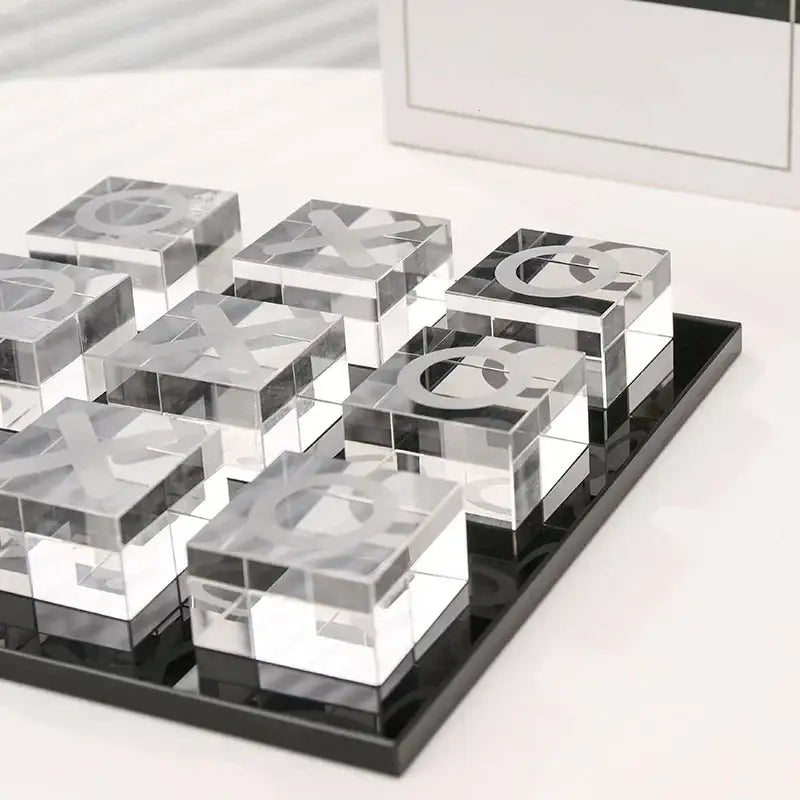 Modern clear acrylic tic tac toe set with engraved x and o cubes on a black tray decorbites geometric crystal chess set