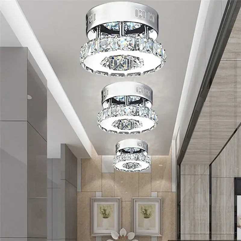Three-tiered modern ceiling lights with chrome bases and cascading clear and amber crystal rings decorbites crystal led