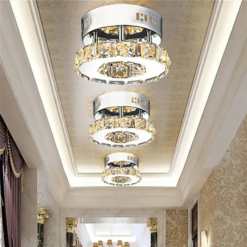 Three tiered modern clear and amber crystal led ceiling lights with chrome frames and golden accents for living room decorbites crystal led