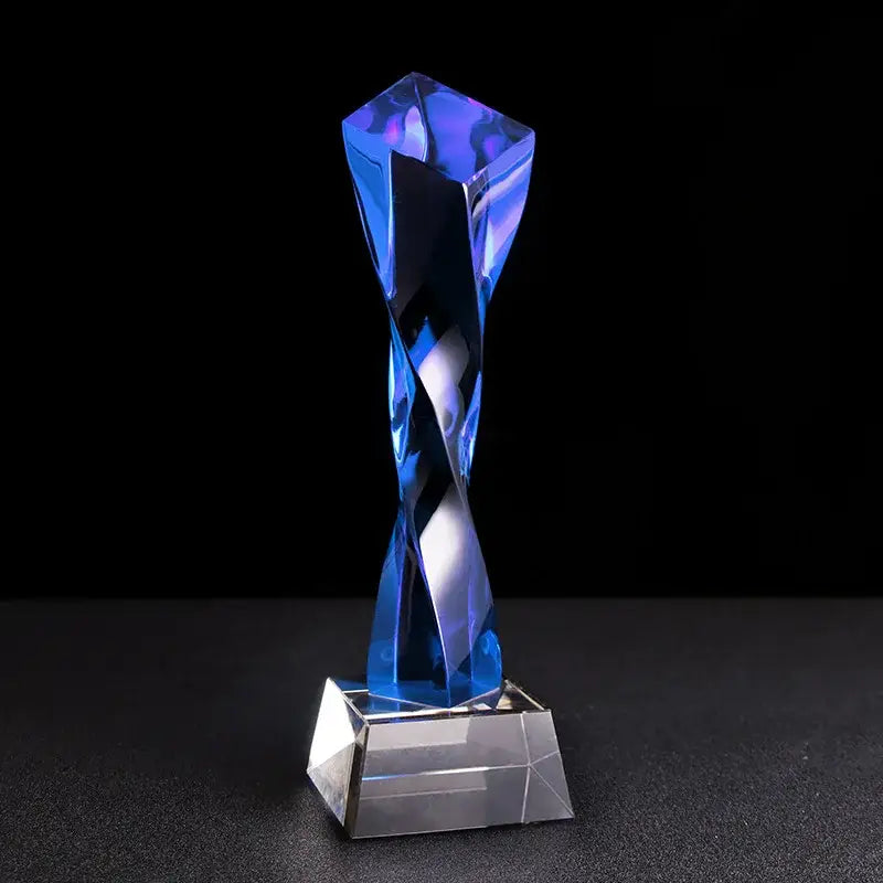 Modern clear and blue glass twisted column trophy featuring a translucent blue glass twisted column with a clear base