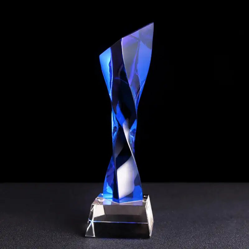 Modern clear and blue glass twisted column trophy with a translucent blue glass twisted design and clear glass base