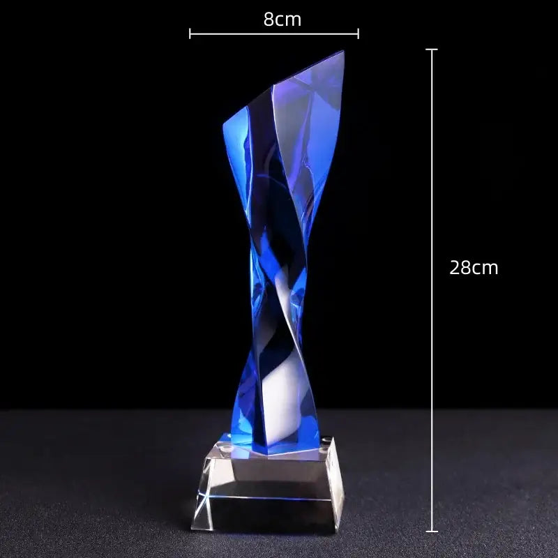 A sleek 28cm tall modern clear and blue glass twisted column trophy with faceted decorbites blue glass design