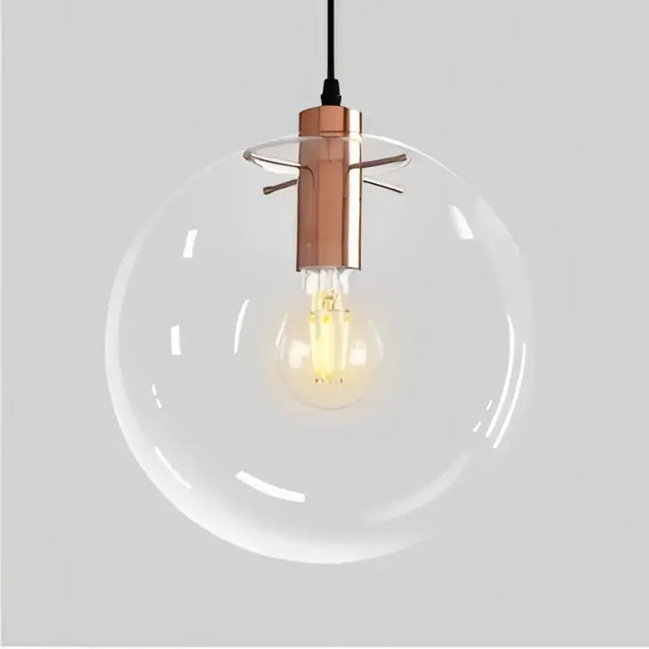 Modern pendant light with clear bubble glass ball, copper-toned metal fixture, and exposed filament bulb by decorbites bubble glass