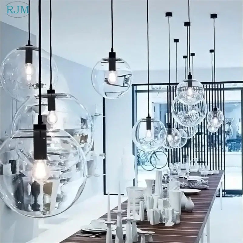 Modern clear bubble glass ball pendant light with black metal fixtures suitable for kitchen decorbites bubble glass decor