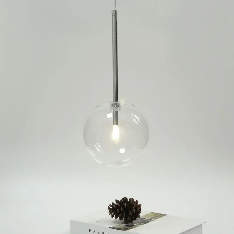 Modern clear bubble glass ball pendant light with clear glass globe and black metal rod fixture for kitchen decorbites pendant light