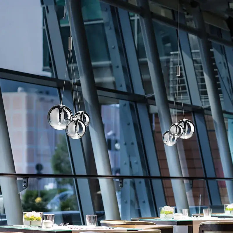 Modern chrome-finished clear bubble glass pendant light with spherical design for dining room decorbites bubble glass
