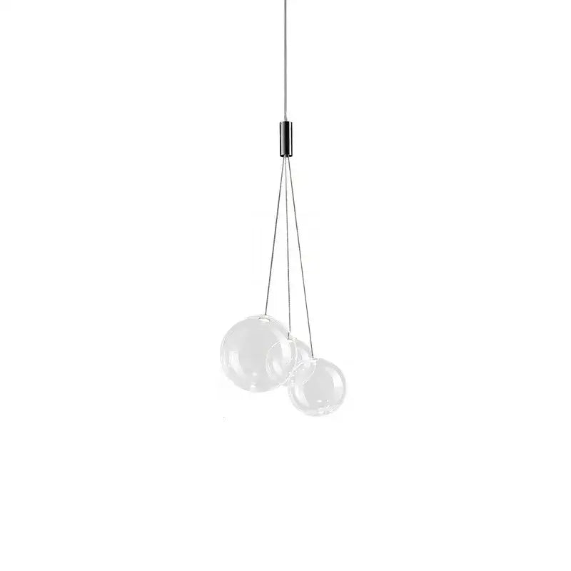Modern clear bubble glass pendant lights featuring three transparent glass spheres suspended from a black fixture ideal for kitchen island decorbites bubble glass pendant lights