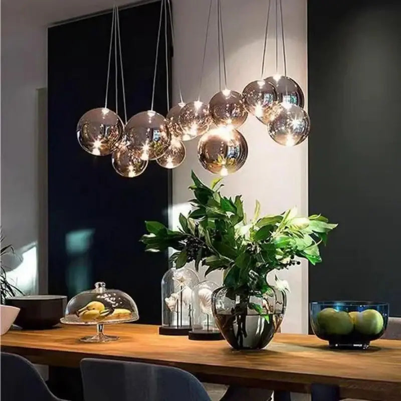 A cluster of modern clear bubble glass pendant lights with metallic finish for kitchen island decorbites bubble glass