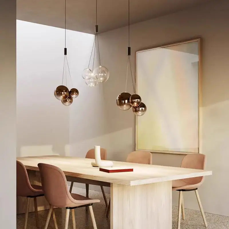 Modern clear bubble glass pendant lights with copper tones hang from the ceiling ideal for kitchen island decorbites bubble glass
