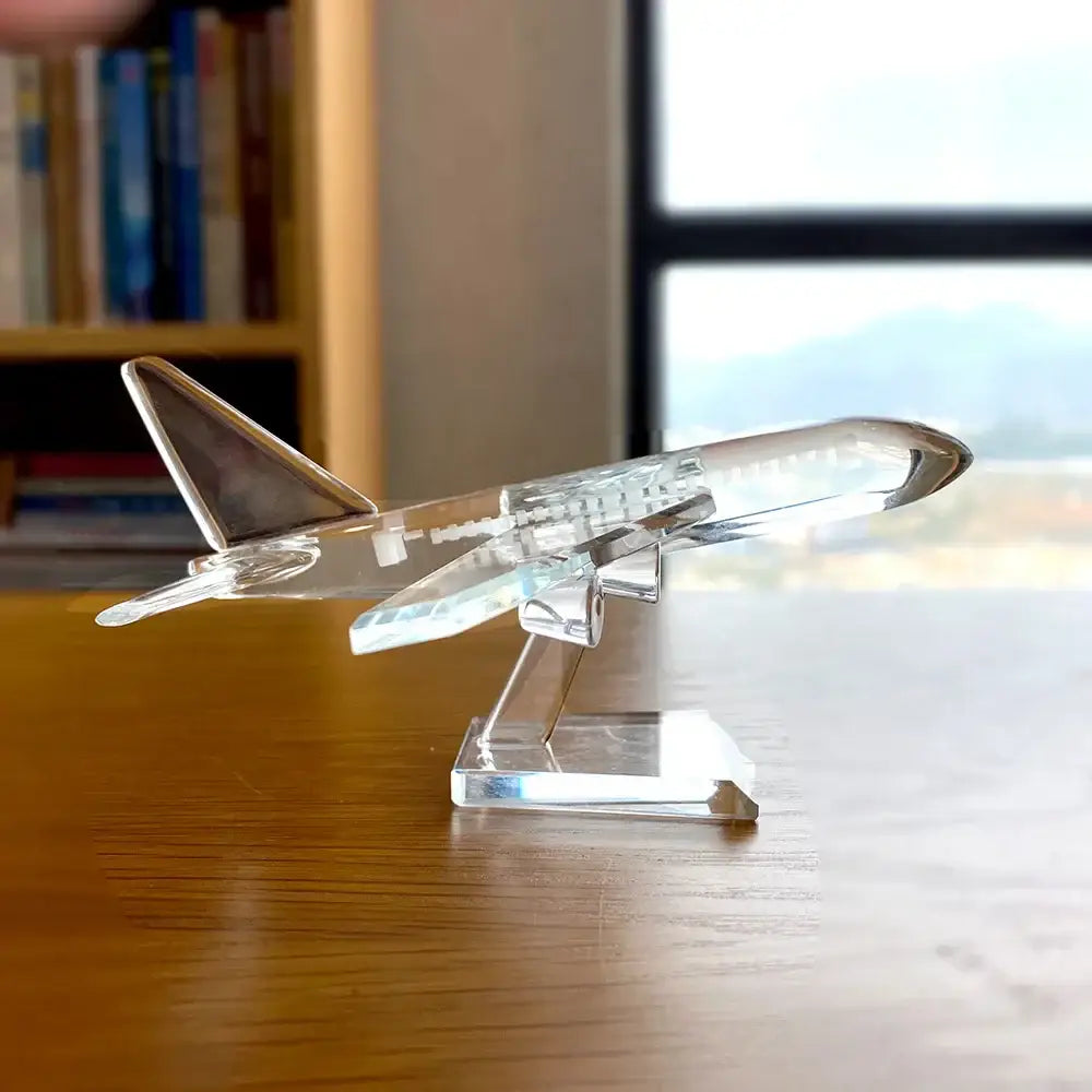 Modern clear crystal aircraft figurine with silver-tipped tail and detailed structure on matching stand for decorbites crystal aircraft decor