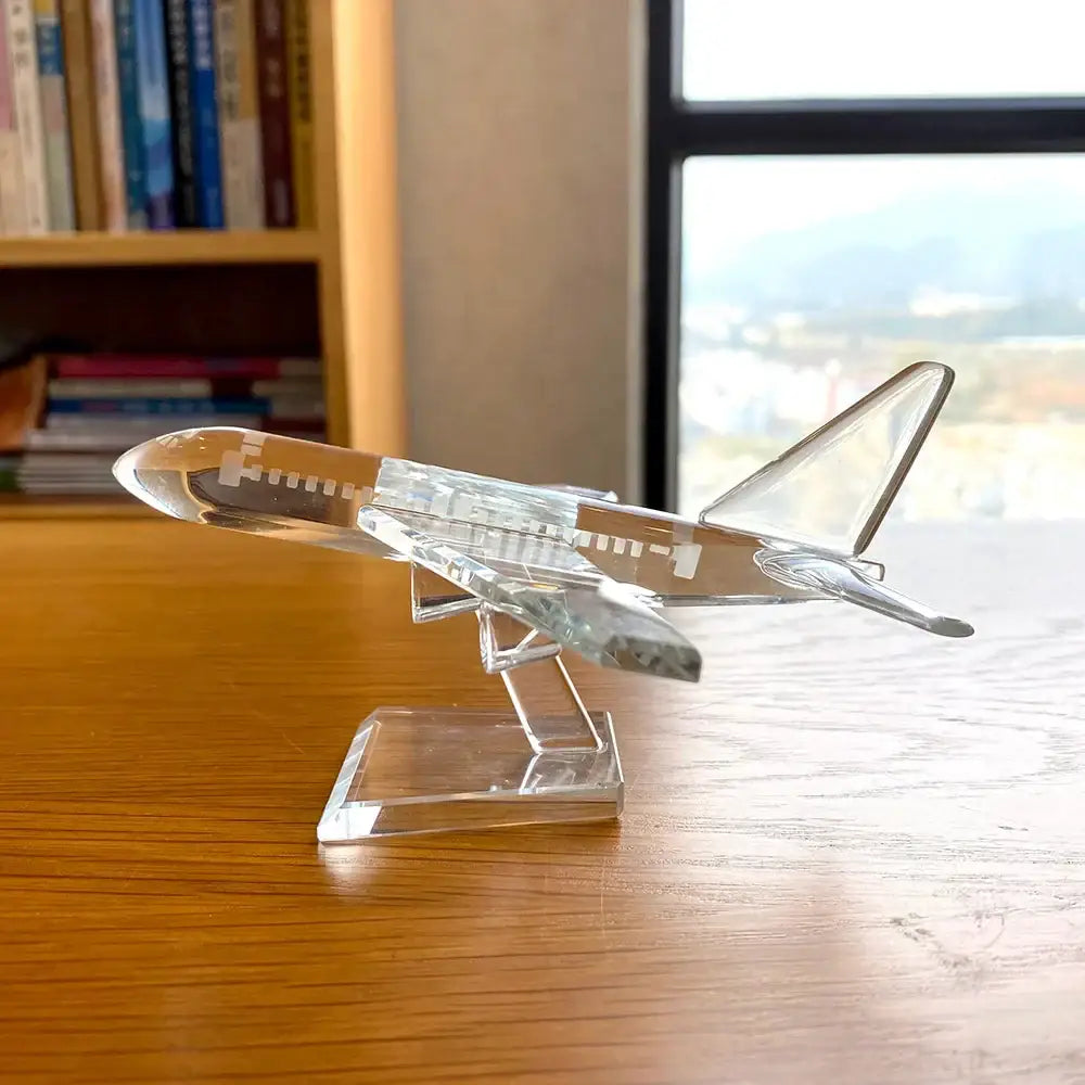 Modern clear crystal aircraft figurine with transparent wings and fuselage on a matching crystalline stand decorbites crystal aircraft