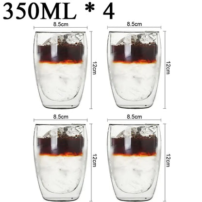 Set of four clear double wall borosilicate glass tumblers with 350ml capacity filled with ice and dark beverage