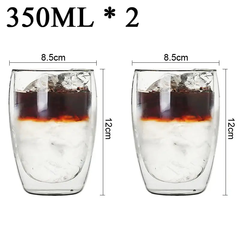 Modern clear double wall borosilicate glass espresso cups filled with ice and layered coffee in kitchen set