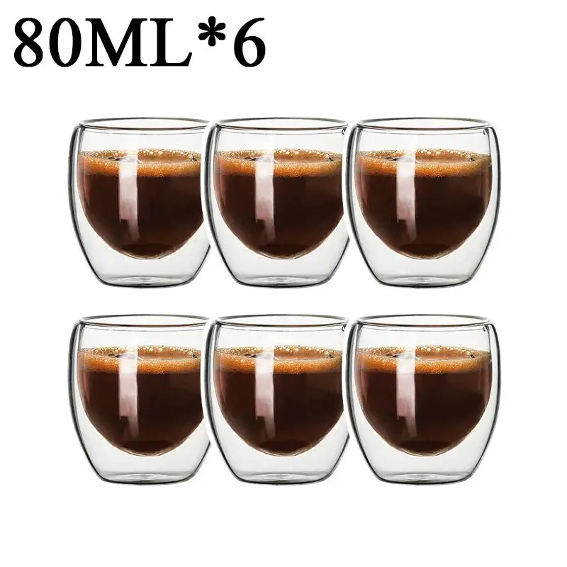 Set of six 80ml modern clear double wall borosilicate glass espresso cups filled with dark espresso and crema layer
