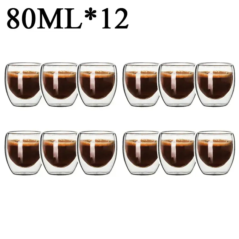 Twelve clear double wall borosilicate glass espresso cups each holding 80ml of dark coffee in modern kitchen set