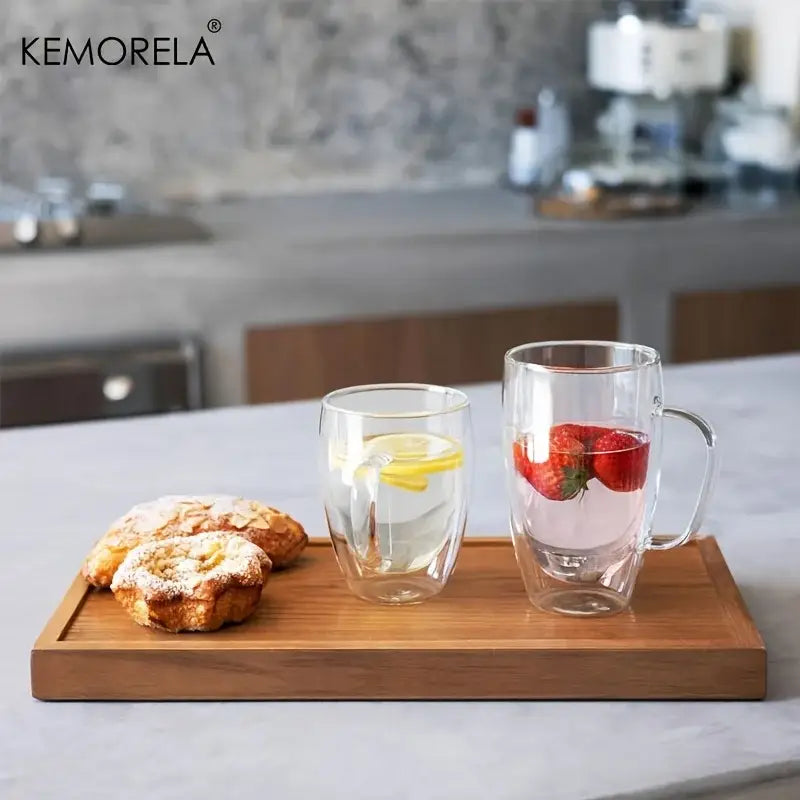 Modern clear double wall glass coffee mug set with handles featuring lemon and strawberry infused drinks