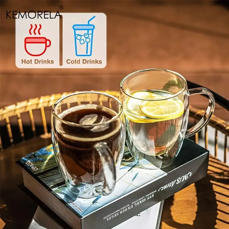 Modern clear double wall glass coffee mug set with handles featuring dark coffee and lemon-infused water