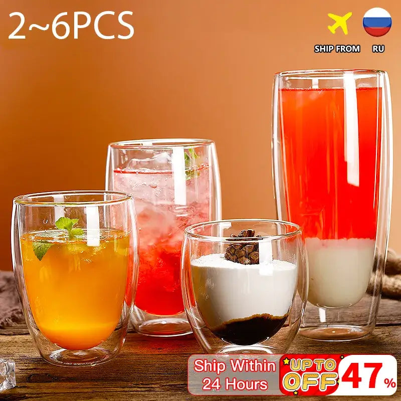 Set of four modern clear double wall glass cup tumblers with varying sizes filled with colorful beverages for dining room use