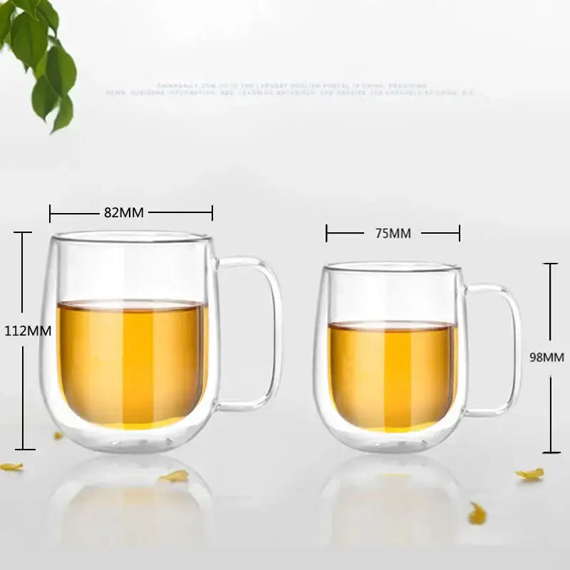 Modern clear double wall glass mug with handle filled with amber liquid for kitchen tea use