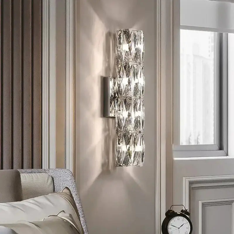 Modern clear faceted crystal wall lamp with decorbites crystal high-end design and reflective metallic base for luxury living room decor