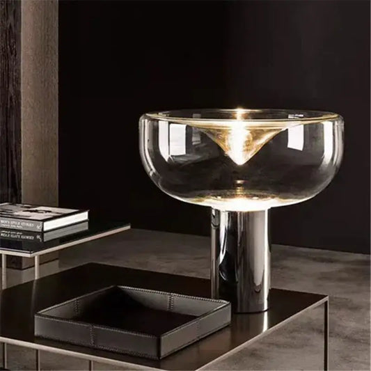 Modern clear glass aella table lamp with sleek chrome base and transparent bowl shade for bedroom office decorbites aella