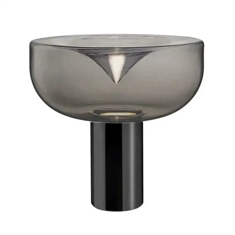 A sleek decorbites aella table lamp with a translucent gray glass bowl and polished black base for modern decor