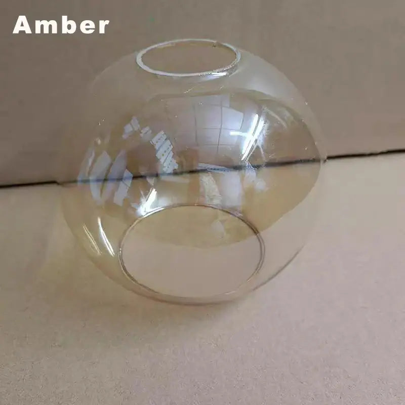 Modern clear glass ball lampshade with subtle amber tint and two openings for living room pendant lights afralia glass ball
