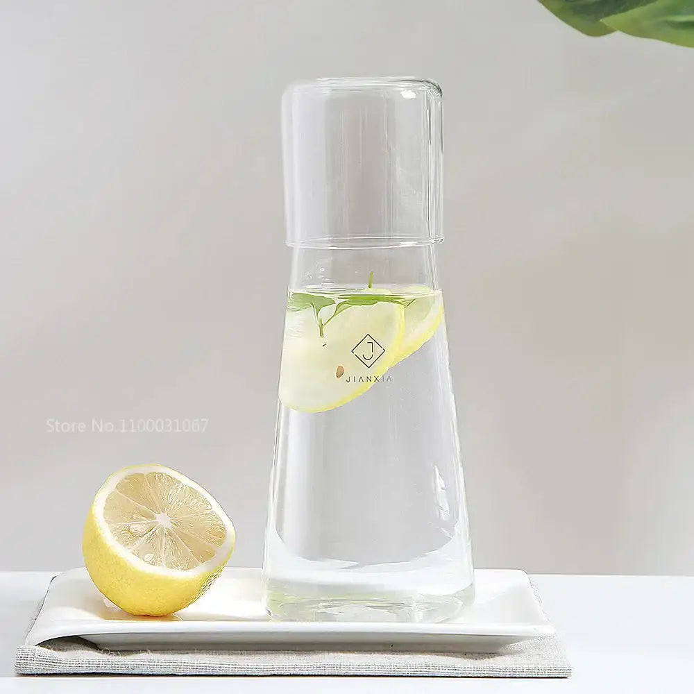 Modern clear glass bedside water carafe set with lid containing sliced lemons and mint leaves for bedroom decorbites clear glass