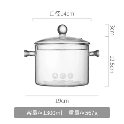 Modern clear glass cooking pot with silver handles and lid featuring a rounded knob for boiling water cooking use