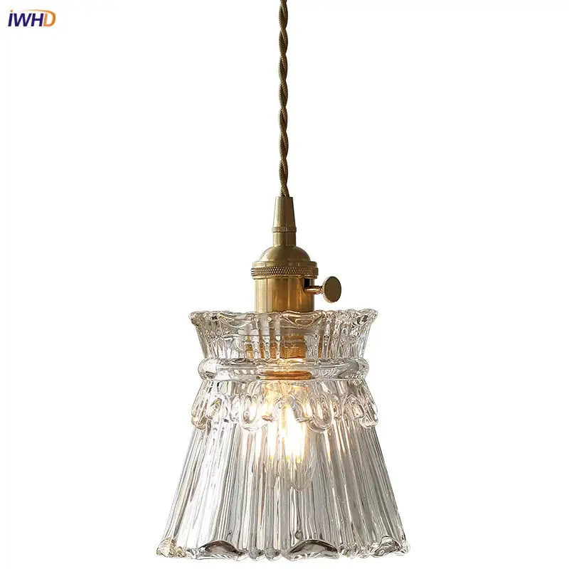 Modern clear glass copper pendant light with brass-finished socket and twisted cord by decorbites pendant light for kitchen decor