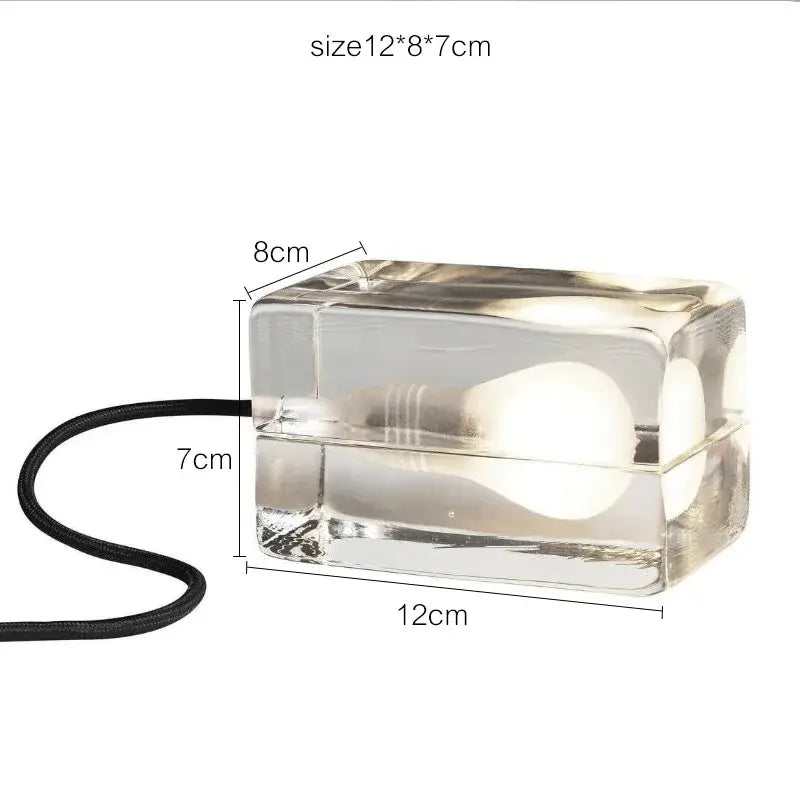 Modern clear glass cube led table lamp with visible bulb and black cord ideal for bedroom nightlight use