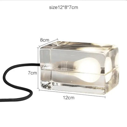 Modern clear glass cube led table lamp with visible bulb and black cord ideal for bedroom nightlight use