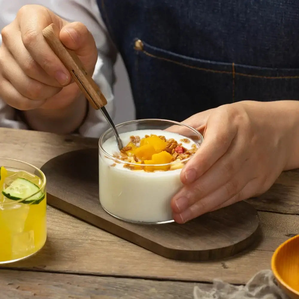 Modern clear decorbites glass cup set featuring a glass bowl with creamy yogurt mango and granola for dessert use