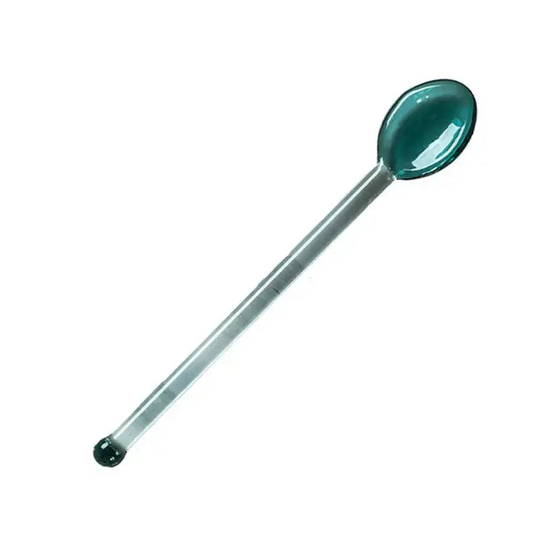 A teal translucent glass spoon with an elongated handle for the modern clear glass dessert cup set dining room glassware