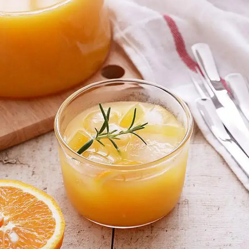 Modern clear glass dessert cup filled with orange juice ice and rosemary from dessert cup set for dining room use