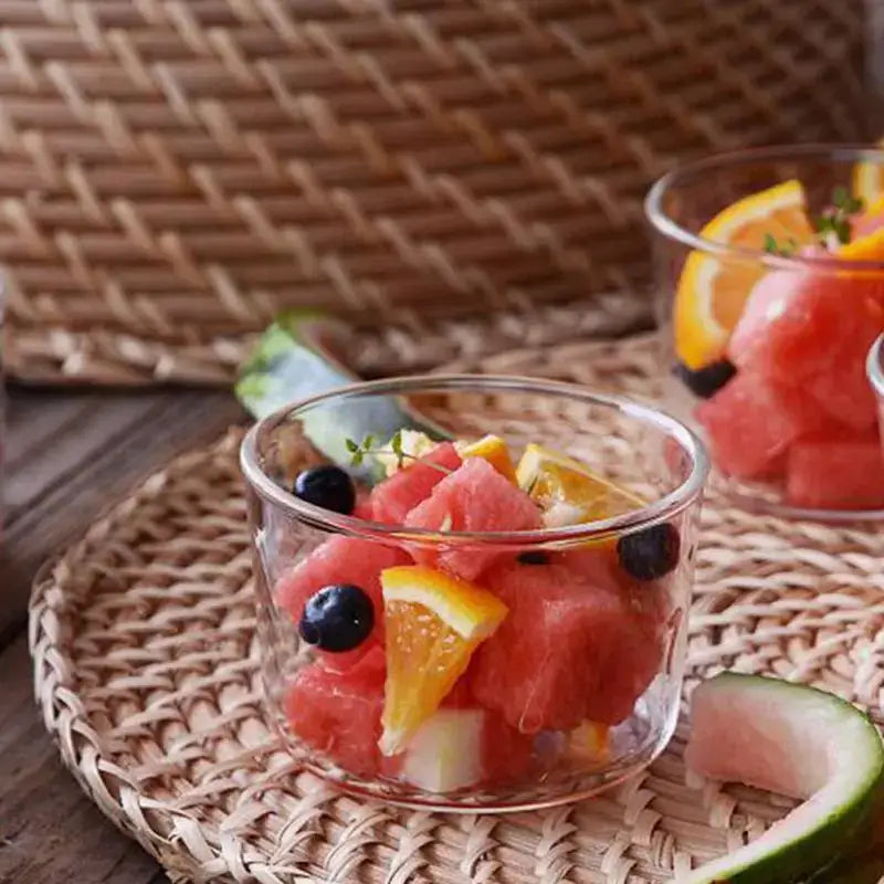 Modern clear glass dessert cup filled with vibrant watermelon cubes, orange slices, and dark blueberries in dessert cup set