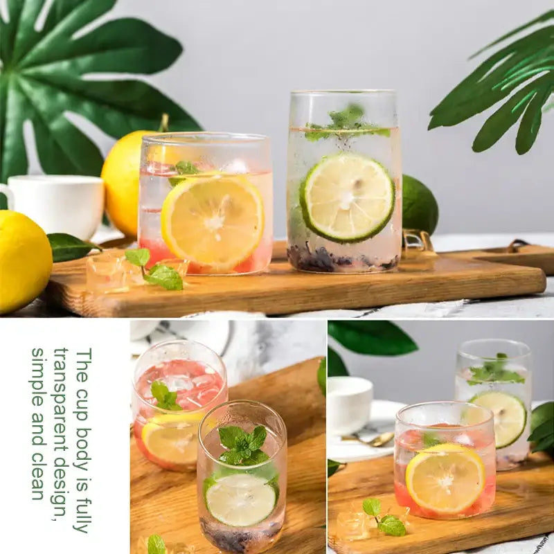 Modern clear glass drinkware cup set featuring transparent tumblers with colorful citrus beverages and fresh mint garnish