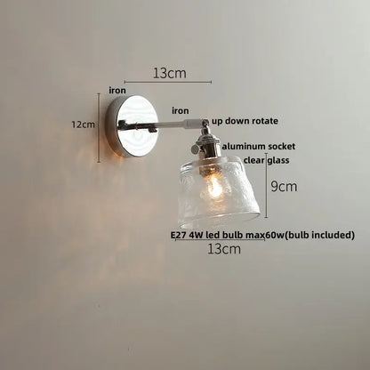 Modern clear glass led wall lamp with polished iron base and adjustable arm for bedroom decorbites clear glass lighting