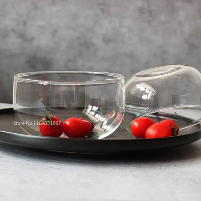 Modern clear glass salad bowl set with matching domed lid featuring minimalist transparent design for food storage