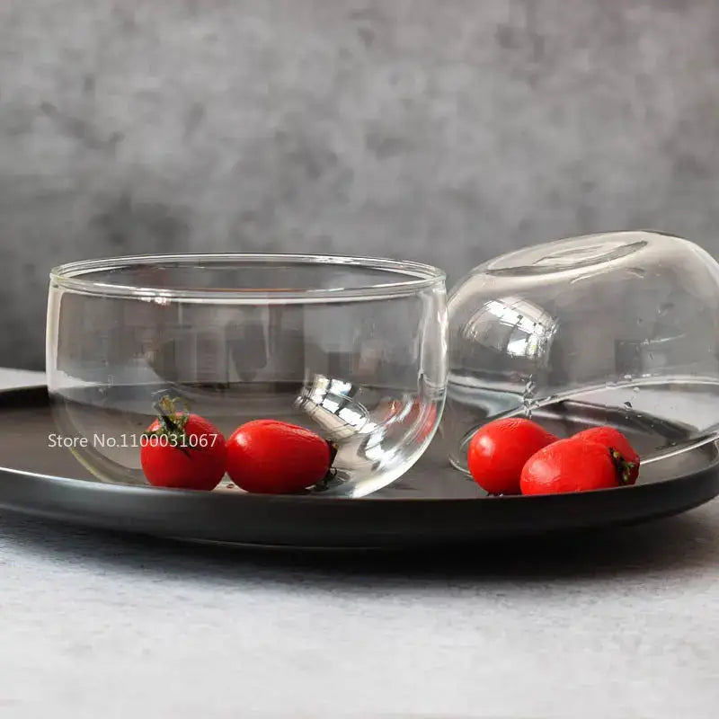Modern clear glass salad bowl set with matching domed lid featuring minimalist transparent design for food storage