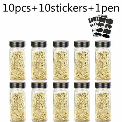Modern clear glass seasoning jar set with ten clear glass seasoning jars with black lids filled with dried herbs