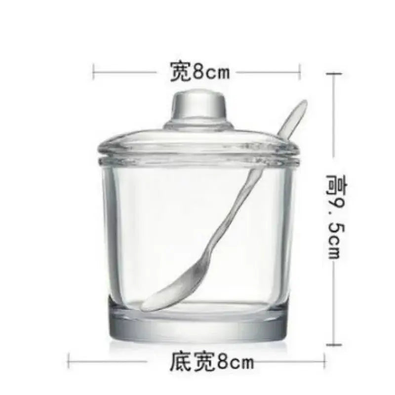 Modern clear glass seasoning spice jar with matching lid and integrated spoon measuring 8cm width and 9.5cm height