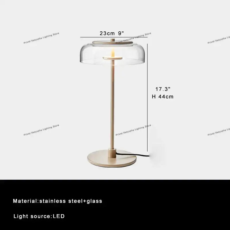 Modern clear glass table lamp with slender stainless steel base and LED light source for bedroom decorbites clear glass