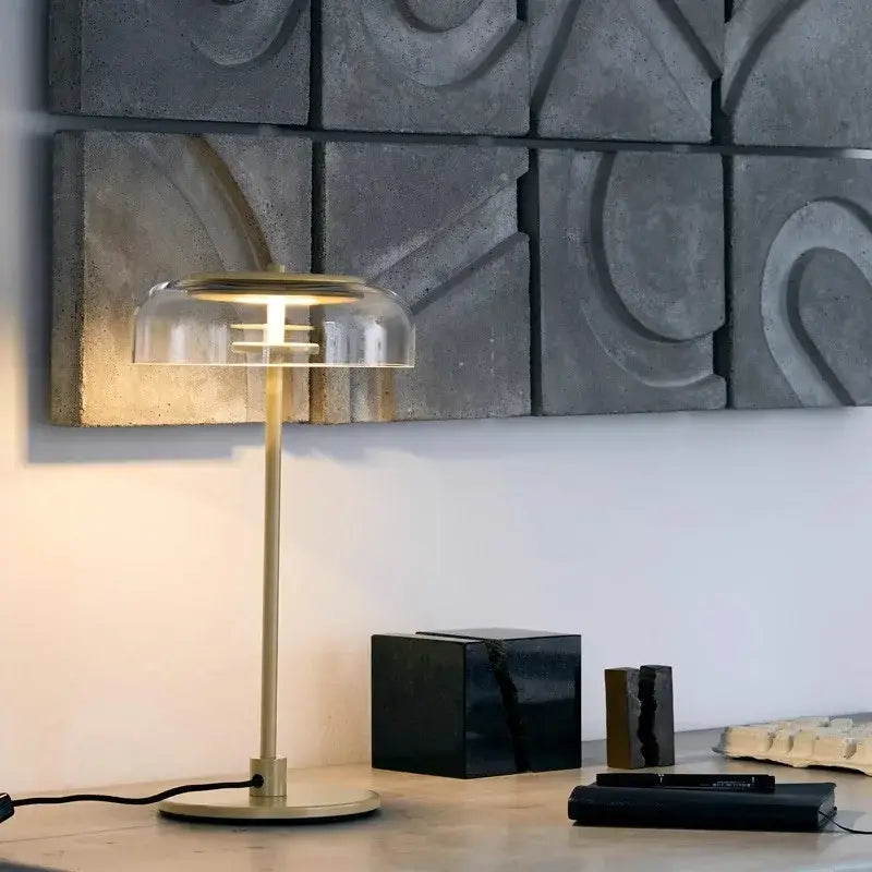 A sleek brass table lamp with clear glass dome and minimalist design for modern decorbites clear glass lighting