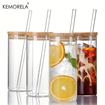 Modern clear glass tumbler cups with bamboo lids and clear straws featuring a sleek design in a 4-piece set